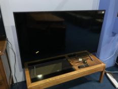 A Samsung Television, with remote