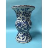 A large Chinese blue and white vase, decorated with serpents and flowering branches, 38cm high, 26cm