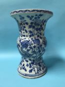 A large Chinese blue and white vase, decorated with serpents and flowering branches, 38cm high, 26cm