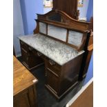 An Edwardian mahogany marble washstand, with mirror back, 129.5cm wide, 134cm high, 56cm deep