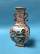 A Chinese famille rose two handled vase, marks to base, 23cm high