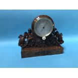 A carved walnut table barometer, by M Pillischer, 88 New Bond Street, London, 34cm wide