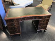 A reproduction mahogany desk, 129cm wide