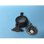 A military compass and pocket watch