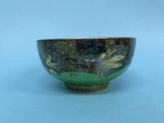 A small Wedgwood Fairyland lustre bowl 'Leap Frogging Elves', pattern number 74968, by Daisy