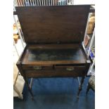 An Edwardian walnut Campaign writing desk with rising top, inset leather interior, with two drawers,
