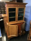 A Victorian mahogany music chest, with two glazed doors to the top, below two panelled doors,