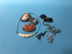 A cameo and various brooches etc.
