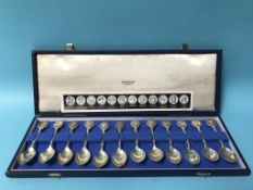 A cased set of twelve John Pinches silver spoons