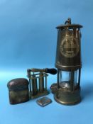 An Eccles miners lamp, cartridge loader, silver vesta and an inkwell