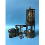 An Eccles miners lamp, cartridge loader, silver vesta and an inkwell