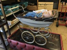 A Silver Cross pram and doll
