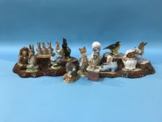 Twelve Beswick Beatrix Potter figures, a Beswick bird and two stands