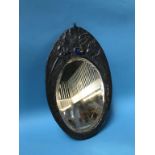 An Art Nouveau oval pewter mirror, inset with coloured enamel cabochon, 37 x 24cm