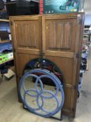 An oak linenfold wardrobe