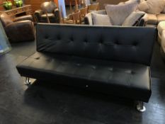 A black leather reclining day bed