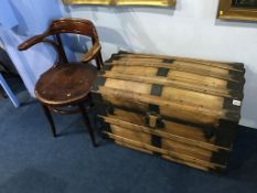 A domed top trunk and two Bentwood chairs