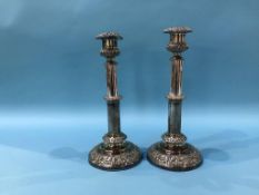 A pair of telescopic silver plated candlesticks