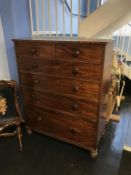 A Victorian mahogany chest of drawers, with two short and four long graduating drawers, all with
