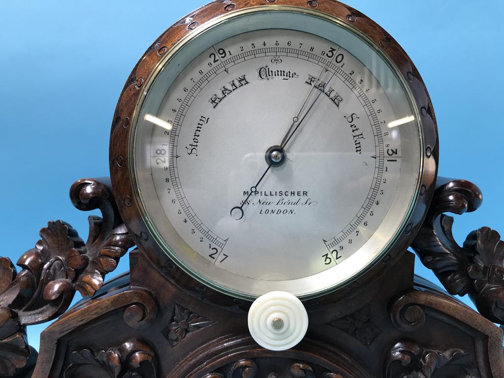 A carved walnut table barometer, by M Pillischer, 88 New Bond Street, London, 34cm wide - Image 2 of 2