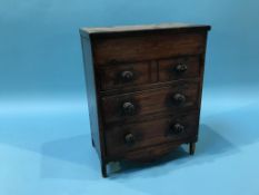 A miniature chest of drawers