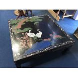 An Oriental lacquered coffee table