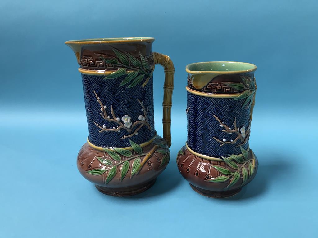 Two Minton Majolica water jugs, with bamboo handles, stamped 618, 24cm and 19cm height, and a salt - Image 3 of 4