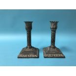 A pair of silver candlesticks, with loaded bases, 'JB' Jane Brownett?, London, 1884
