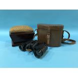 A Victorian mahogany sarcophagus shaped pin cushion and a pair of binoculars