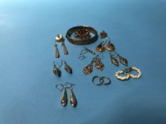 A quantity of gold coloured earrings and a plated bangle etc.