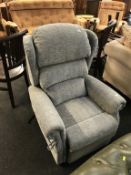 A grey rise and recliner electric armchair