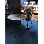 A plant stand and a tripod table