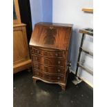 A reproduction mahogany bureau