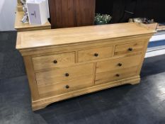 A light oak chest of drawers, 151cm wide