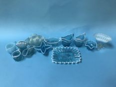 Twelve pieces of blue Pearline glassware