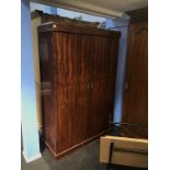 A mahogany double door wardrobe