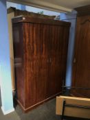 A mahogany double door wardrobe