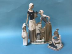 Two Lladro figures and a Nao group of two ladies by a fountain