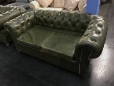 A Victorian green leather drop end Chesterfield settee, with original castors