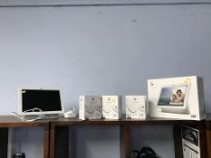 A Google Nest Hub Max and three boxed Chromecasts