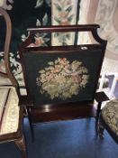 A Campaign writing desk, ebonised chair and mahogany fire screen