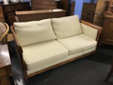A modern Empire style two seater settee
