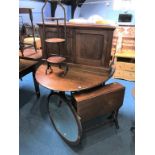 An oak gateleg table, oval mirror, Sutherland table, cake stand and two door cabinet