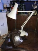 A 1970's brown telephone and an angle poise lamp