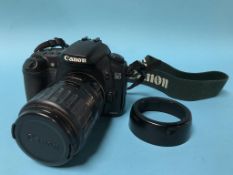 A Canon EOS 20D camera and EF 35-135mm, 1:4-5.6 lens
