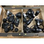 Two trays of cameras and lenses, to include Canon, Nikon and Pentax