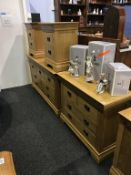 Two light oak chest of drawers and a pair of bedside chests