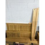 A light oak blanket box and bed frame