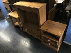 A pine bookcase, side table and bedside chest