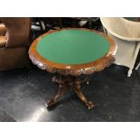 A Victorian walnut and marquetry demi lune fold over card table